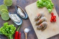 Food ingredient background. New Zealand mussel, shrimp, peppers, salad, salt , wood plate lime or lemon on table Royalty Free Stock Photo