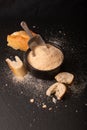 Food ingredients homemade organic bread crumbs in black ceramic bowl on black slate board Royalty Free Stock Photo