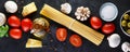 Food ingredients for italian pasta, spaghetti on black stone slate background. Banner Royalty Free Stock Photo