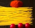 Food ingredients for italian pasta, spaghetti on black stone slate background. Royalty Free Stock Photo