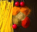 Food ingredients for italian pasta, spaghetti on black stone slate background. Royalty Free Stock Photo