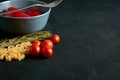 Food ingredients for Italian spaghetti on black background with much copy space of your project. Royalty Free Stock Photo