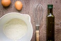 Food ingredients and kitchen utensils for cooking on wooden background Royalty Free Stock Photo