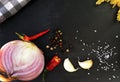 Food ingredients - onion, spaghetti, chilli ,garlic,salt and pepper Royalty Free Stock Photo