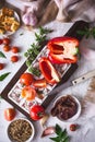 Food Ingredients for preparing Meal with Red Pepper, Tomatoes, Coppa Ham, Halloumi and Dukkah Spices