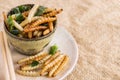 Food Insects: Bamboo worm Bamboo Caterpillar insect fried crispy for eating as food items on plate with chopsticks on sackcloth