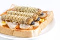 Food Insects: Worm beetle or Witchetty grub for eating as food items made of cooked insect meat on bread baked sandwich on plate, Royalty Free Stock Photo