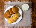 Food, junk-food, culinary, baking and eating concept - close up oatmeal cookies and milk glass Royalty Free Stock Photo