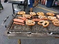 Food On A Large BBQ Grill, Barbeque, Hot Dogs and Soft Pretzels Royalty Free Stock Photo