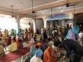 Langar is being ditributed to the Punjabi sikh people that have gathered inside a gurudwara