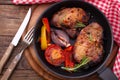 Food. Meat barbecue with vegetables on wooden surface.