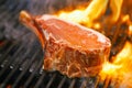 Food meat - beef steak on bbq barbecue grill with flame Royalty Free Stock Photo