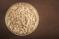 Food. Oatmeal on the table. Dry rolled oat flakes oatmeal Royalty Free Stock Photo