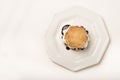 Food : Overhead close up of a jam scone with fresh, thick cream. 3