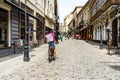 A Food Panda food delivery courier on a bike in Old Town of Bucharest, Romania, 2020. Food deliveries by bike couriers due to Royalty Free Stock Photo