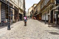 A Food Panda food delivery courier on a bike in Old Town of Bucharest, Romania, 2020. Food deliveries by bike couriers due to Royalty Free Stock Photo