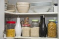 Food pantry with storage jars of pasta rice jasmine Royalty Free Stock Photo