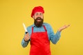 Food with passion. special offer from chef. chef in restaurant kitchen. mature male chef on yellow backdrop. happy man Royalty Free Stock Photo