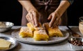 Food pastry recipe chef cooking baklava. Food pastry dessert recipe concept. Chef making baklava with nuts at restaurant. Royalty Free Stock Photo