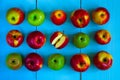 Food-pattern, apples on a blue wooden background