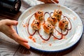 Food photographer takes picure of sushi rolls Royalty Free Stock Photo