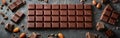 Empty Chocolate Frame on Dark Table - Milk Chocolate Blocks and Pieces - Food Photography Background Royalty Free Stock Photo