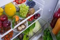 Food photography of a clean fridge filled with vegan foods such as fruits vegetables, juices and plant milk Royalty Free Stock Photo