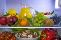 Food photography of a clean fridge filled with vegan foods such as fruits vegetables, juices and plant milk Royalty Free Stock Photo