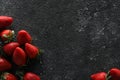 Food photography. Delicious ripe strawberries on black textured table, flat lay with space for text