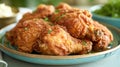 Food photography, fried chicken, golden and crispy, captured mid-drip with honey on a classic blue diner plate