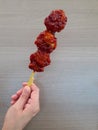 close-up of spicy chicken karaage skewer