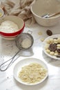 Some food making tools are placed on the white marble table