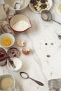 Some food making tools are placed on the white marble table