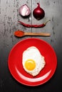 Food placed on red plate on black background, top view Royalty Free Stock Photo