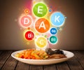 Food plate with delicious meal and healthy vitamin symbols Royalty Free Stock Photo