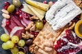 Food Platter With Truffle Cheese, Duck Breast, Brie Cheese, Pecan Nuts, Pomegranate Seeds, Grapes, Almonds, Honey, Olives Royalty Free Stock Photo