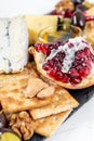 Food Platter With Truffle Cheese, Duck Breast, Brie Cheese, Pecan Nuts, Pomegranate Seeds, Grapes, Almonds, Honey, Olives Royalty Free Stock Photo