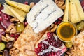 Food Platter With Truffle Cheese, Duck Breast, Brie Cheese, Pecan Nuts, Pomegranate Seeds, Grapes, Almonds, Honey, Olives Royalty Free Stock Photo