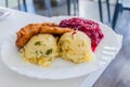 Food in Poland - breaded chicken filet, mashed potatoes and bee