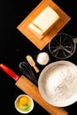 Food preparation concept over head shot kitchen tools for Kneading dough for bakery, pizza or pasta on black background with copy Royalty Free Stock Photo