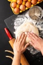 Food preparation concept over head shot Kneading dough for bakery, pizza or pasta on black background with copy space Royalty Free Stock Photo