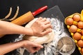 Food preparation concept over head shot Kneading dough for bakery, pizza or pasta on black background with copy space Royalty Free Stock Photo