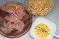 Food Preparing. Raw Chiken Breast Meat and Raw eggs with Homemade Pasta with Spices, s and herbs. Top view