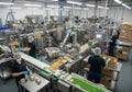 A food processing facility with conveyor belts and automated machinery. Workers in protective gear, Royalty Free Stock Photo