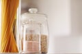 Food products in glass jars in the kitchen, pasta, cereal, salt, wine, groceries