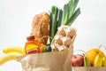 Food products from the grocery shop. Food shopping and delivery concept. Bread, eggs, bananas, fruits and vegetables in the brown Royalty Free Stock Photo