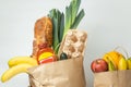 Food products from the grocery shop. Food shopping and delivery concept. Bread, eggs, bananas, fruits and vegetables in the brown Royalty Free Stock Photo