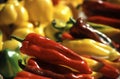 Food products, red and yellow peppers on market stall. Royalty Free Stock Photo