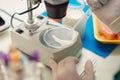 Food quality control expert inspecting at milk specimen in the laboratory