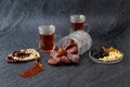 Food Ramadan Sweets mixed of dried fruits and nuts Glass Tea with rosary and the Quran on the table